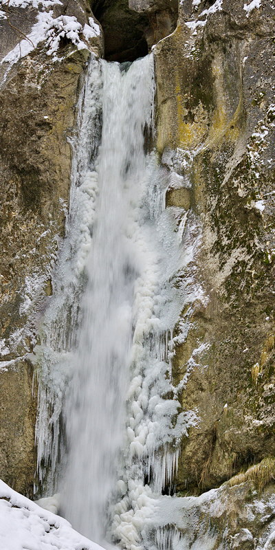 Photograph of Barbennaz waterfall running through the ice